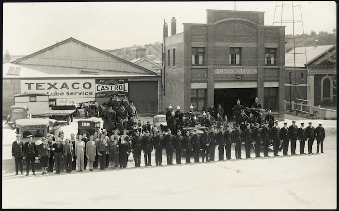 Crown Studio (Gore), fl 1940s : Photograph taken at Gore, Southland, showing staff of a fire brigade; a fire brigade auxillary; and an Ambulance Transport Section of the Women's War Service Auxiliary