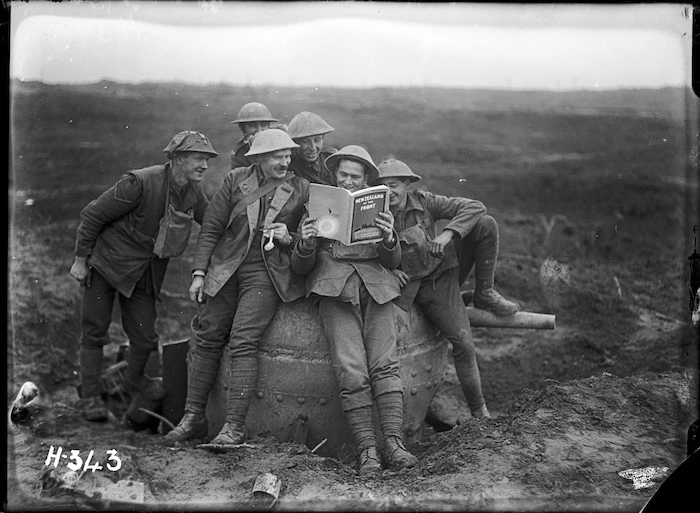 World War I New Zealand soldiers with a copy of 'New Zealand at the Front'