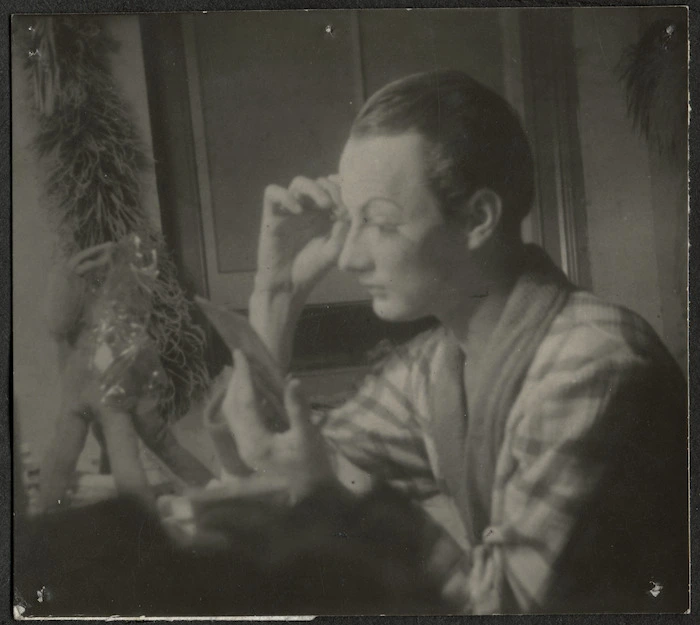 Actor Ralph Dyer making up in his dressing room