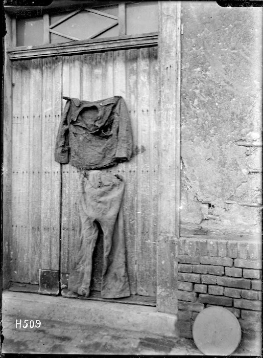 Clothing fixed to a door, location unidentified