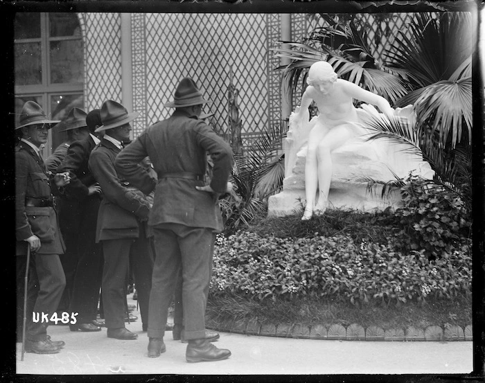 World War I New Zealand soldiers looking at a statue of a female, France