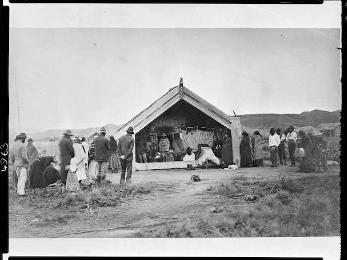 Maori tangi at meeting house, (Ruatapu, West Coast?) - Photographer possibly Alfred Burton