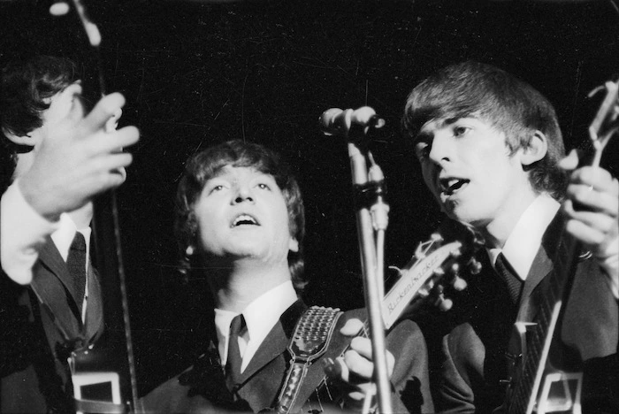 Beatles Paul McCartney, John Lennon and George Harrison singing during their Wellington concert