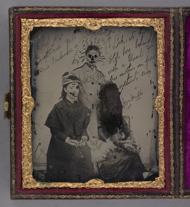 Group portrait of two women and a man