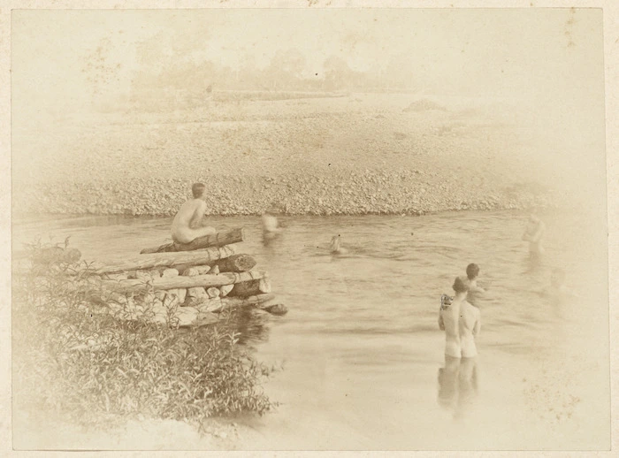 Men bathing in a river