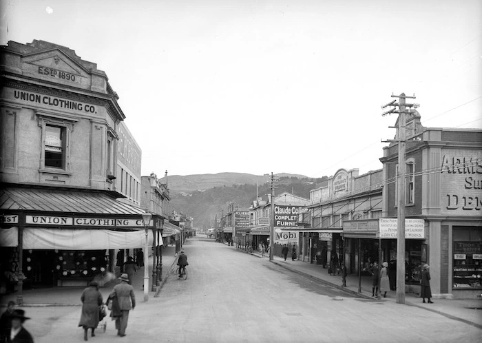 Looking down Jackson Street, Petone, with the Union Clothing Co on the left and Butland's Building, next to the business of Thos Blyth, on the right