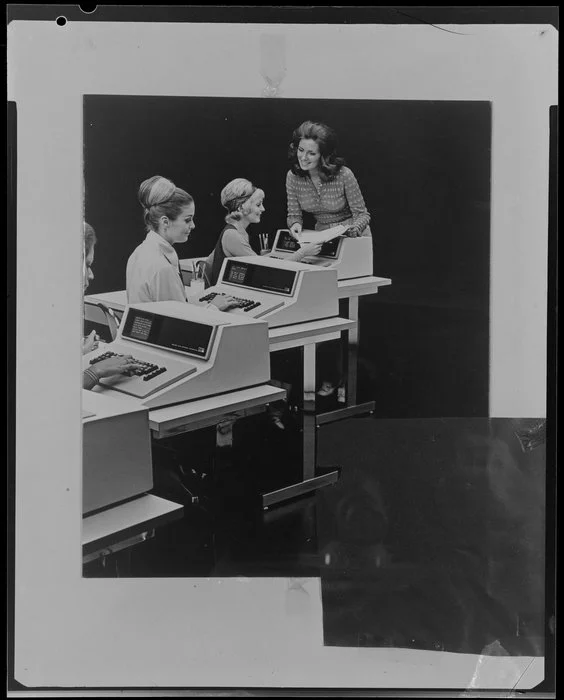 Woman working with computers in office