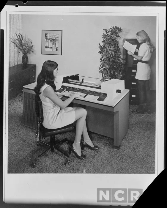Woman working with computers in office