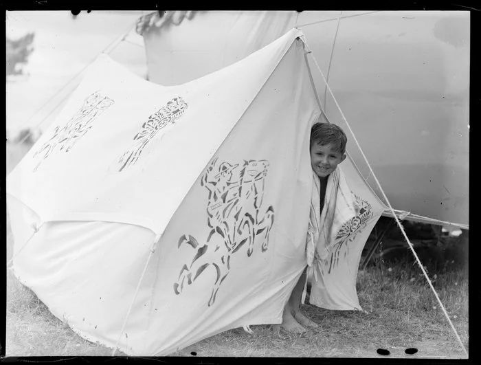 Summer Child Studies series, unidentified boy, looking out of a tent