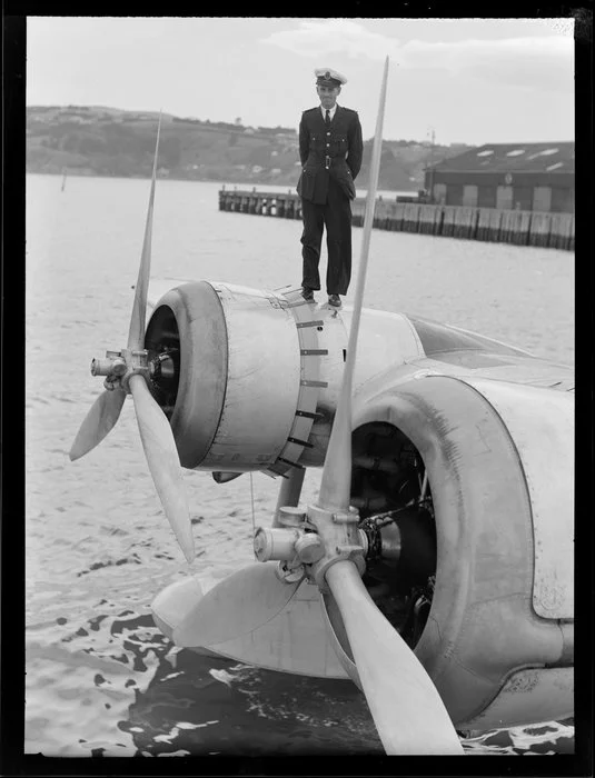 Crew member, standing on the flying boat, Centaurus, Dunedin Harbour