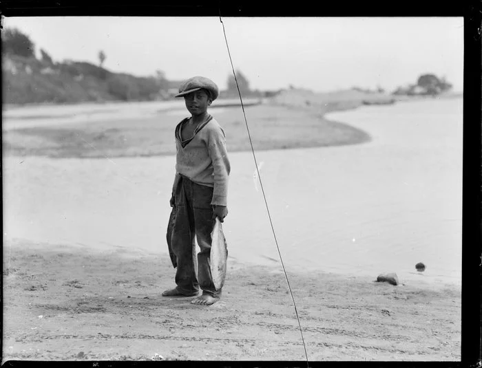 Maori boy carrying fish, Waikato