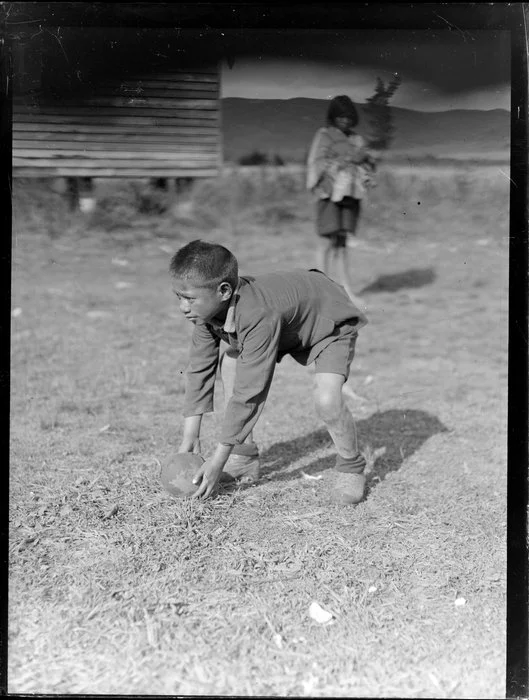 Māori boy with a rugby ball, Waikato
