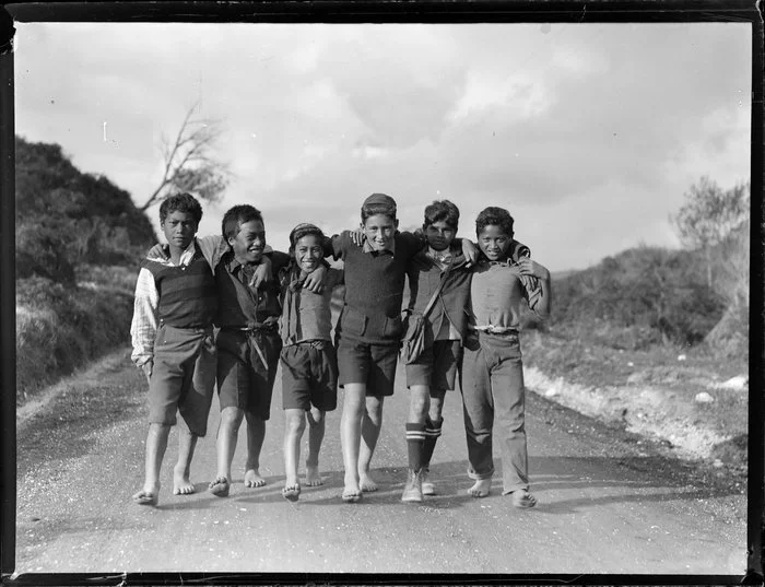 Māori boys walking down a road, Waikato