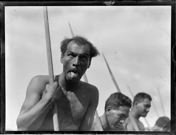 A Maori man doing the pūkana during a performance, location unidentified