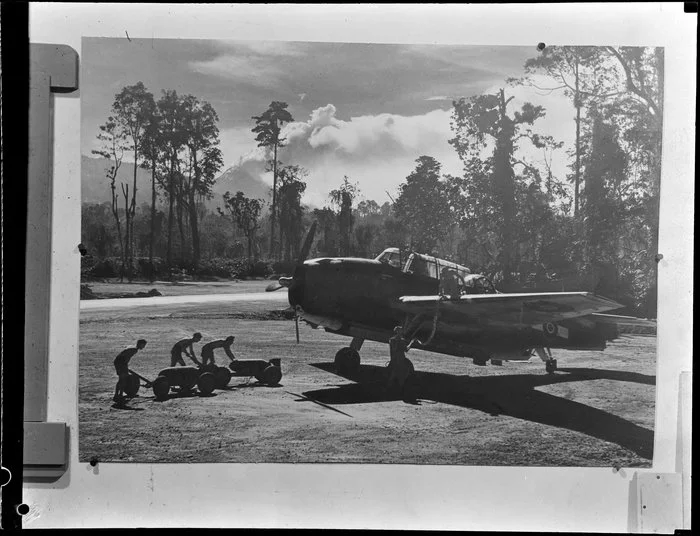 Men loading bombs onto a Grumman Avenger on Bougainville Island