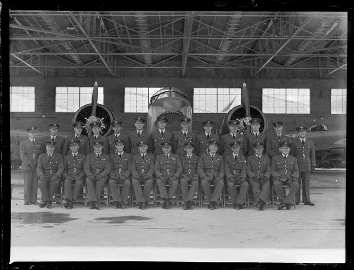 Officers of RNZAF base Hobsonville, with plane