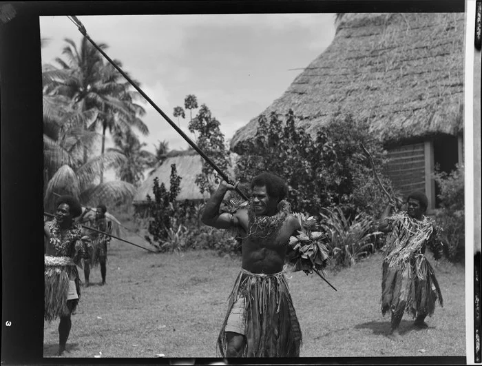 Male dancers with long spears at the meke, Lautoka, Fiji