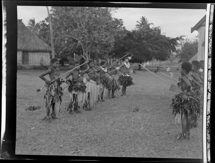 Boys performing a spear dance at the meke, Vuda village, Fiji