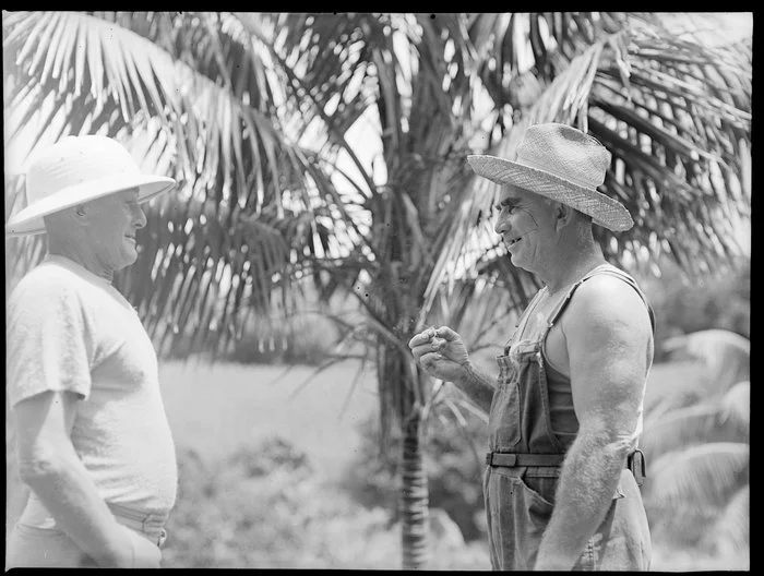 Two unidentified men; one in overalls and both wearing sunhats, Norfolk Island