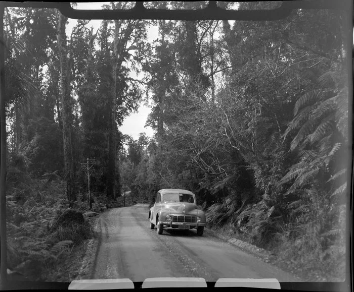 Morris Minor car on the road near the township of Ross, West Coast