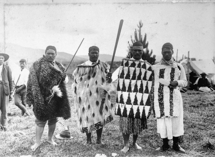 Ross, Malcolm, 1862-1930 :Young men of Tuhoe land, in flax and feather mats