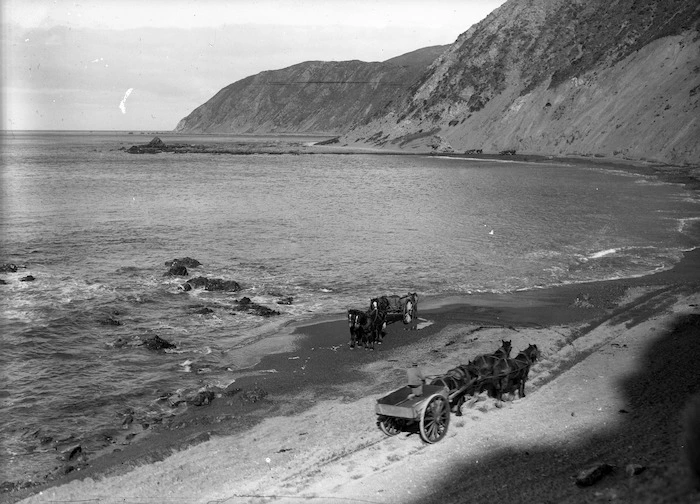 Owhiro Bay, Wellington, showing two horse drawn carriages on the beach
