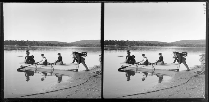 Man, launching a boat, rowed by a man and woman with a woman and child in the rear, Catlins, Otago