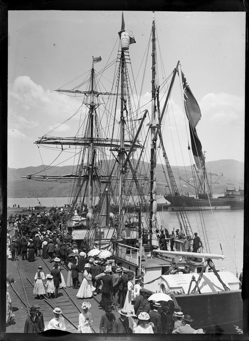 Crowd at Lyttelton Wharf, Christchurch, to witness the departure of ship 'Nimrod' for Antarctica, on British Antarctic Expedition, showing men, women, and children on ship and on wharf alongside