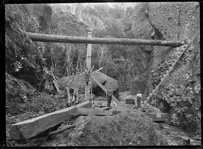 Construction site of a dam on the Anawhata Stream, for the transportation of kauri logs.