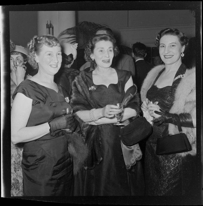 Thelma Bader and unidentified guests at a cocktail party held for her husband, double-amputee and World War II veteran Douglas Robert Steuart Bader