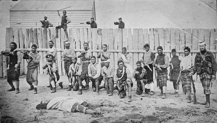 Captain Thomas Porter with his Maori auxiliaries outside a stockade and blockhouse