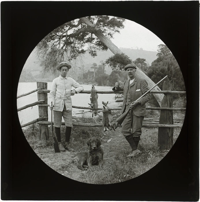 Boy and Aubrey Whitcombe, after rabbit hunting, Catlins River, Otago