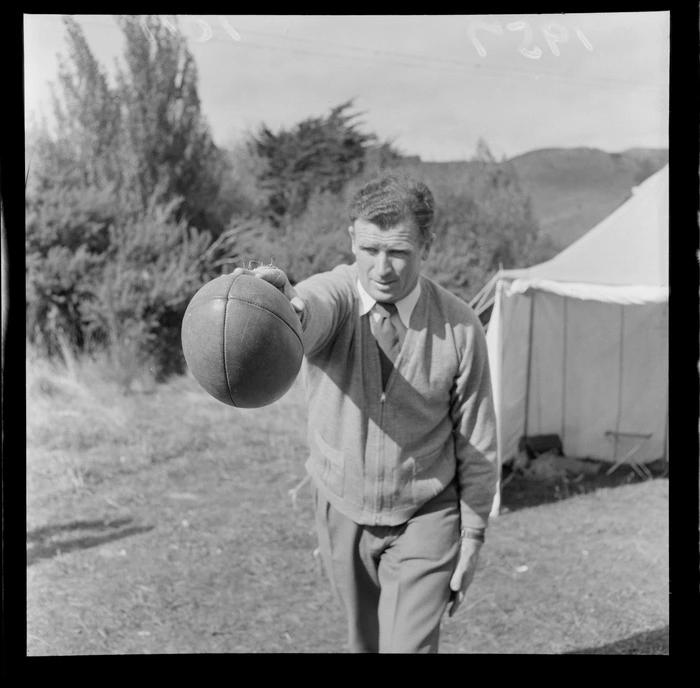 Bill Scullion demonstrates the Scullion Pass with a rugby ball, Delaney Park, Stokes Valley