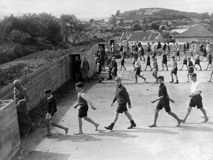 Devonport school pupils entering air raid shelters