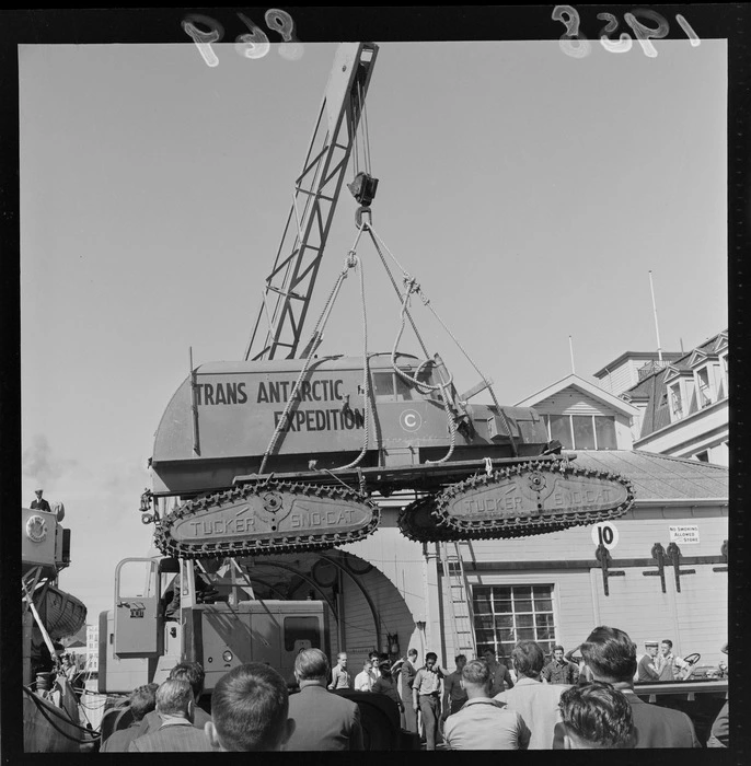 Trans Antarctic Expedition sno-cat being lifted by crane from the HMS Endeavour to the Wharf, Wellington