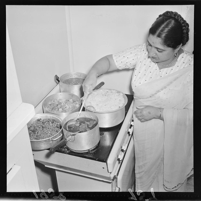 Unidentified woman preparing Indian food