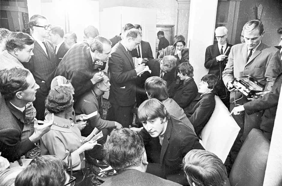 Media interviewing The Beatles, 1964