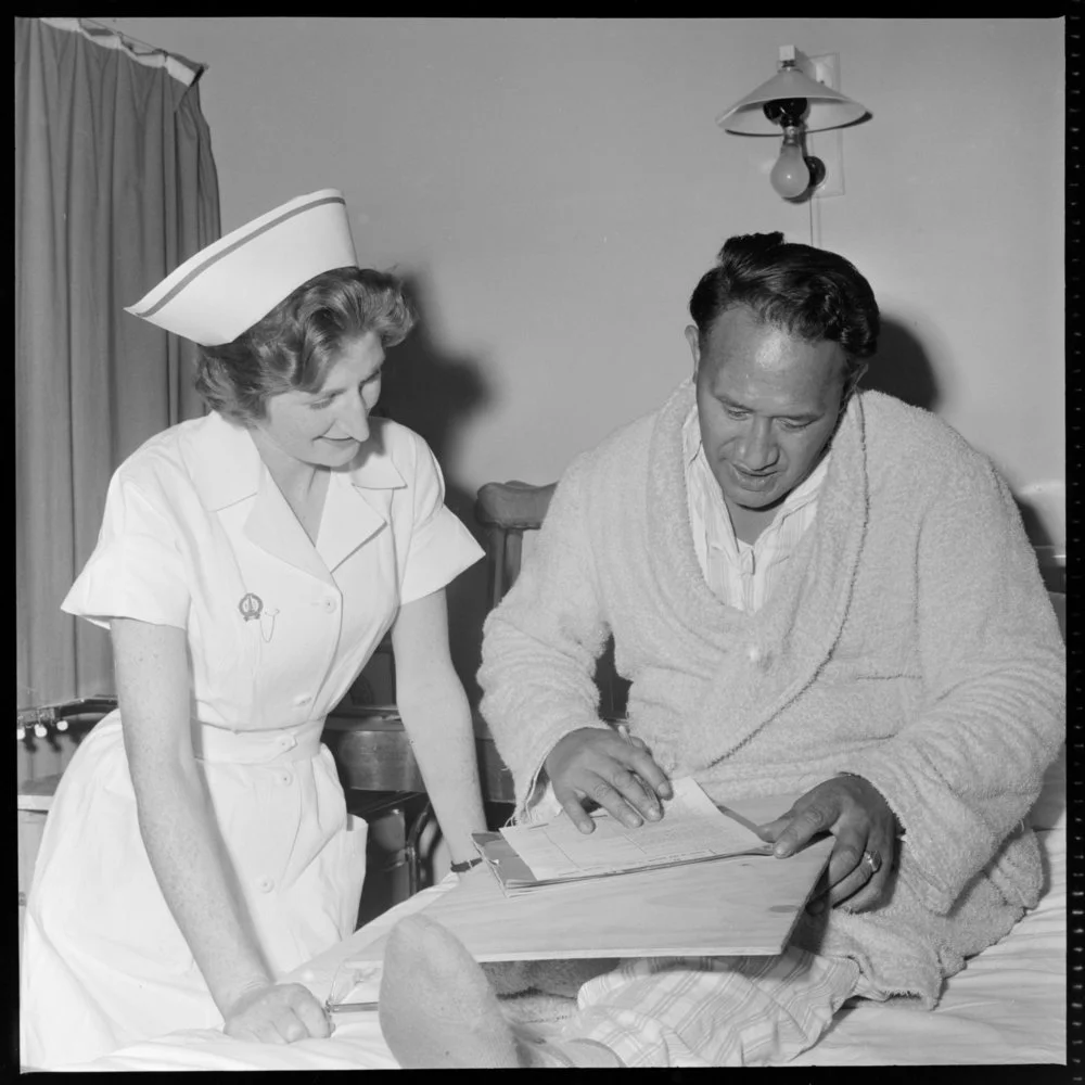 A patient filling in census form with sisters help