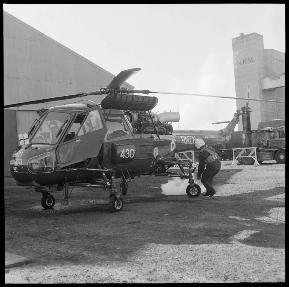 Fire extinguisher being used on Wasp helicopter