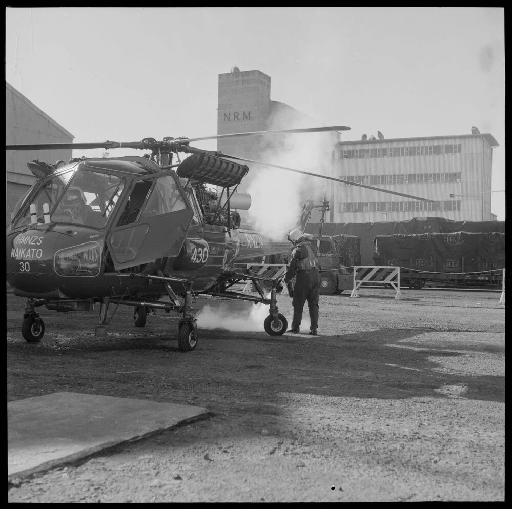Fire extinguisher being used on Wasp helicopter