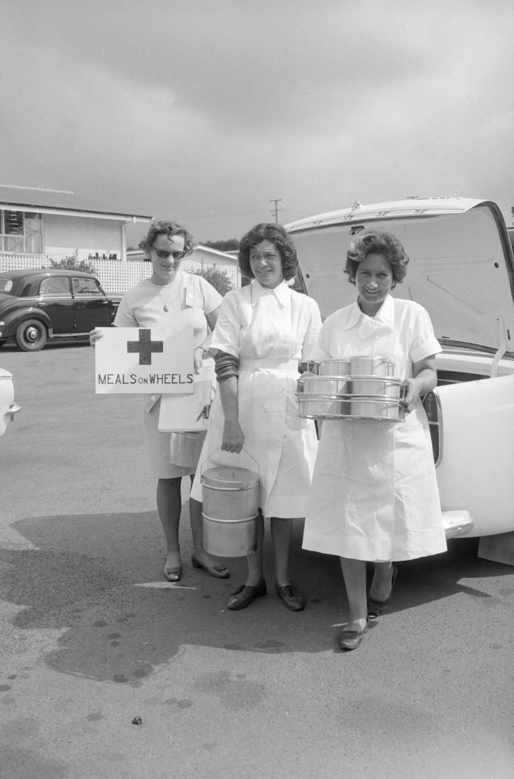 Three Meals on Wheels women at back of car