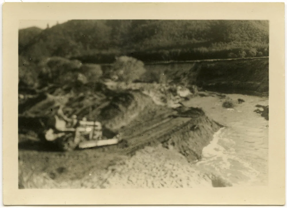 Bulldozer clearing land near river