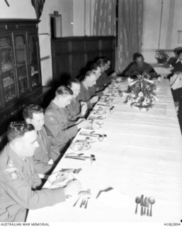 Officers from the British Commonwealth Forces Korea (BCFK) attend a formal dinner in an officers' mess in Japan.   Included amongst the groups of officers and non commissioned officers (NCOs) in ..