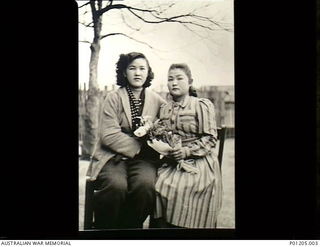 Otake, Japan. 1946-12. Two Japanese housegirls, women civilian employees at the 2nd New Zealand Division Cavalry Regiment Camp. This New Zealand unit was in Japan as part of the British ..