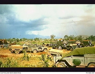BIEN HOA PROVINCE, VIETNAM, 1965-07. LANDROVERS AND TRAILERS BELONGING TO 161 FIELD BATTERY, ROYAL NEW ZEALAND ARTILLERY, SHORTLY AFTER THE UNIT'S ARRIVAL AT ITS BASE CAMP AT THE BIEN HOA AIR BASE, ..