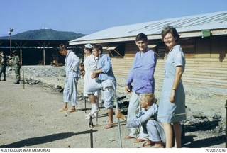 Commandant Janice Webb (now Hilton) (far right), Australian Red Cross, with walking wounded at 8 Field Ambulance. The men were about to be transported to the Vung Tau airstrip for an RAAF C130-E ..