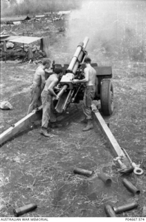 At Fire Support Base (FSB) Baton, an FSB of the Army of the Republic of Vietnam (ARVN), the gun crew of a 105mm M2A2 Howitzer of 101 Field Battery Royal Australian Artillery (RAA) fires and ..