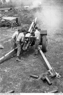 At Fire Support Base (FSB) Baton, an FSB of the Army of the Republic of Vietnam (ARVN), the gun crew of a 105mm M2A2 Howitzer of 101 Field Battery Royal Australian Artillery (RAA) re-loads their ..