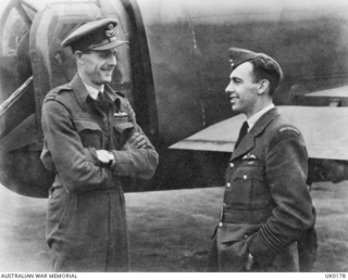 RAF STATION BOTTESFORD, LEICESTER, ENGLAND. 1943-06-05. FLIGHT LIEUTENANT E. K. SINCLAIR, MELBOURNE, VIC, RAF (LEFT) AND SQUADRON LEADER K. F. THIELE DSO DFC AND BAR, ROYAL NEW ZEALAND AIR FORCE, ..
