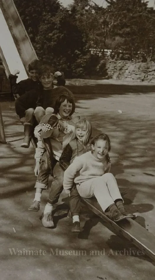 Five children on a slide at Victoria Park